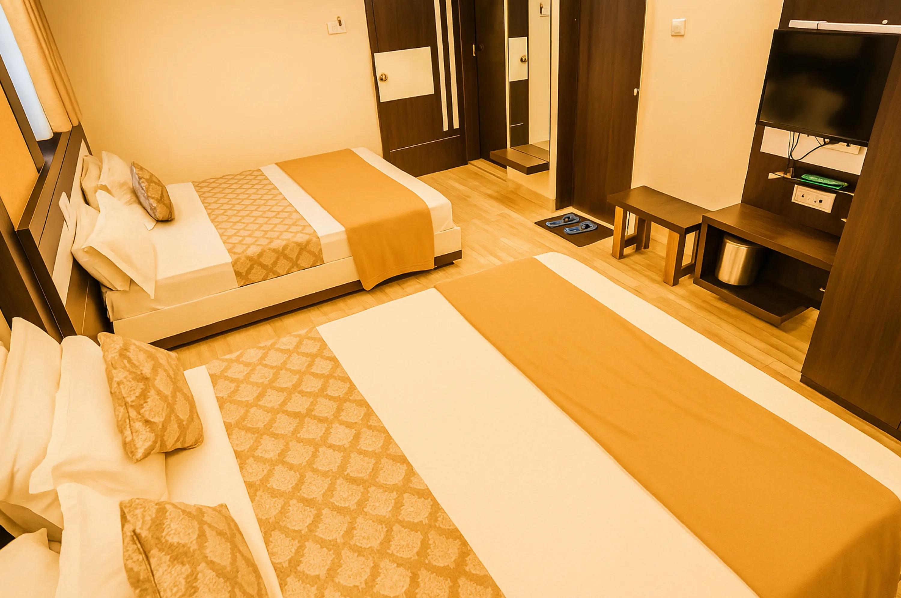 Budget four bed non AC room near Somnath Temple at Hotel Vrajbhoomi Somnath.