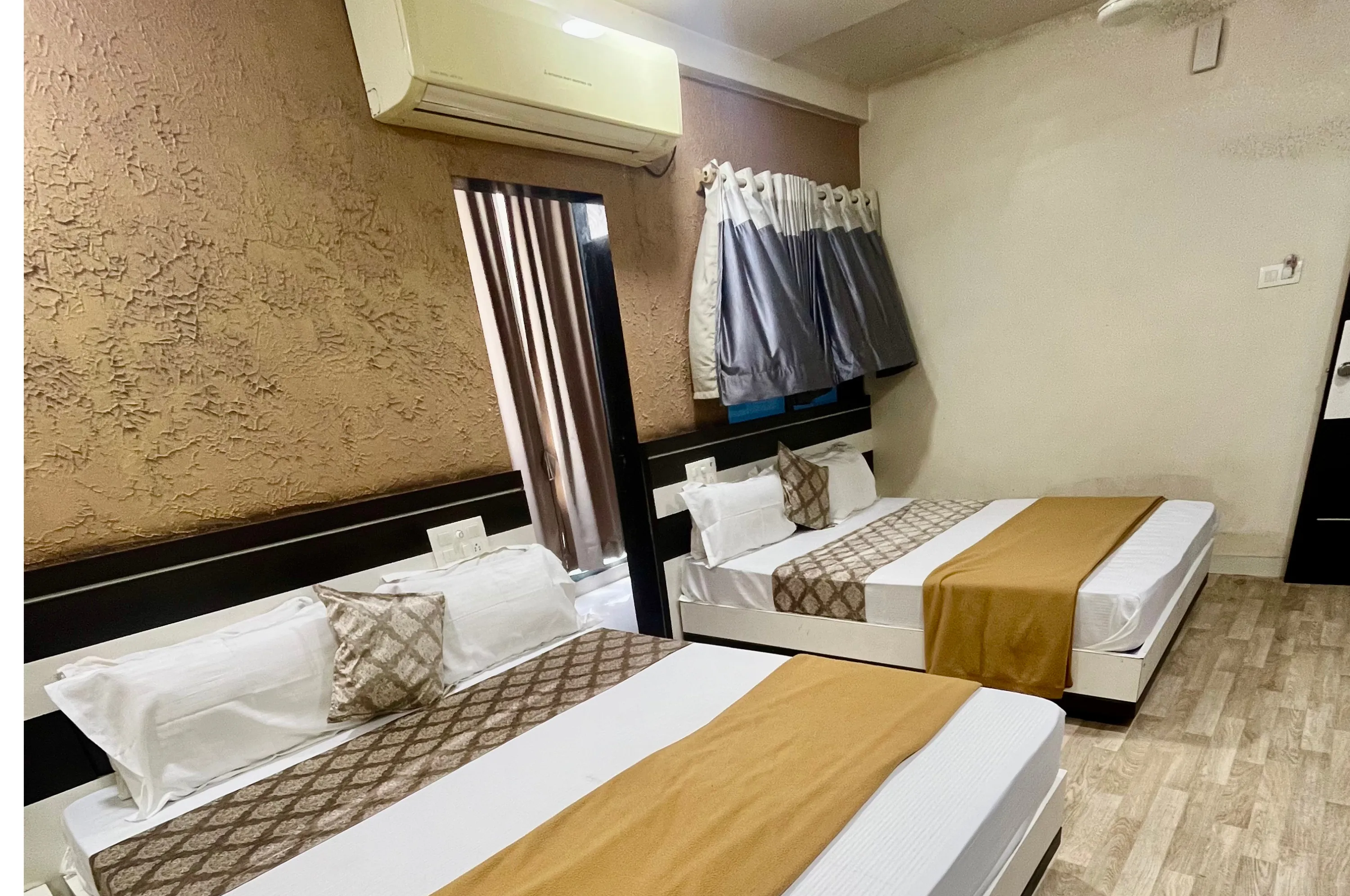 Four bed AC deluxe family stay near Somnath Temple at Hotel Vrajbhoomi Somnath.