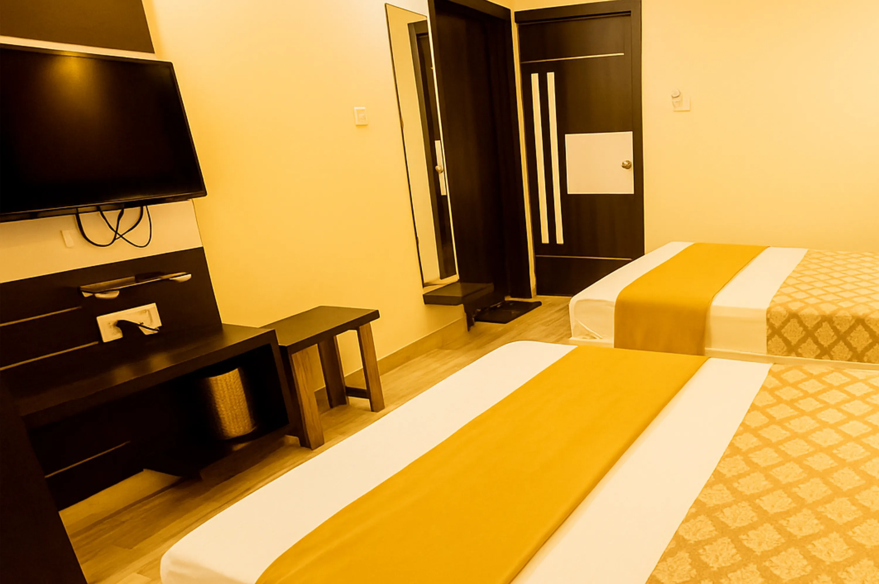 Spacious four bed AC room for families in Somnath at Hotel Vrajbhoomi Somnath.