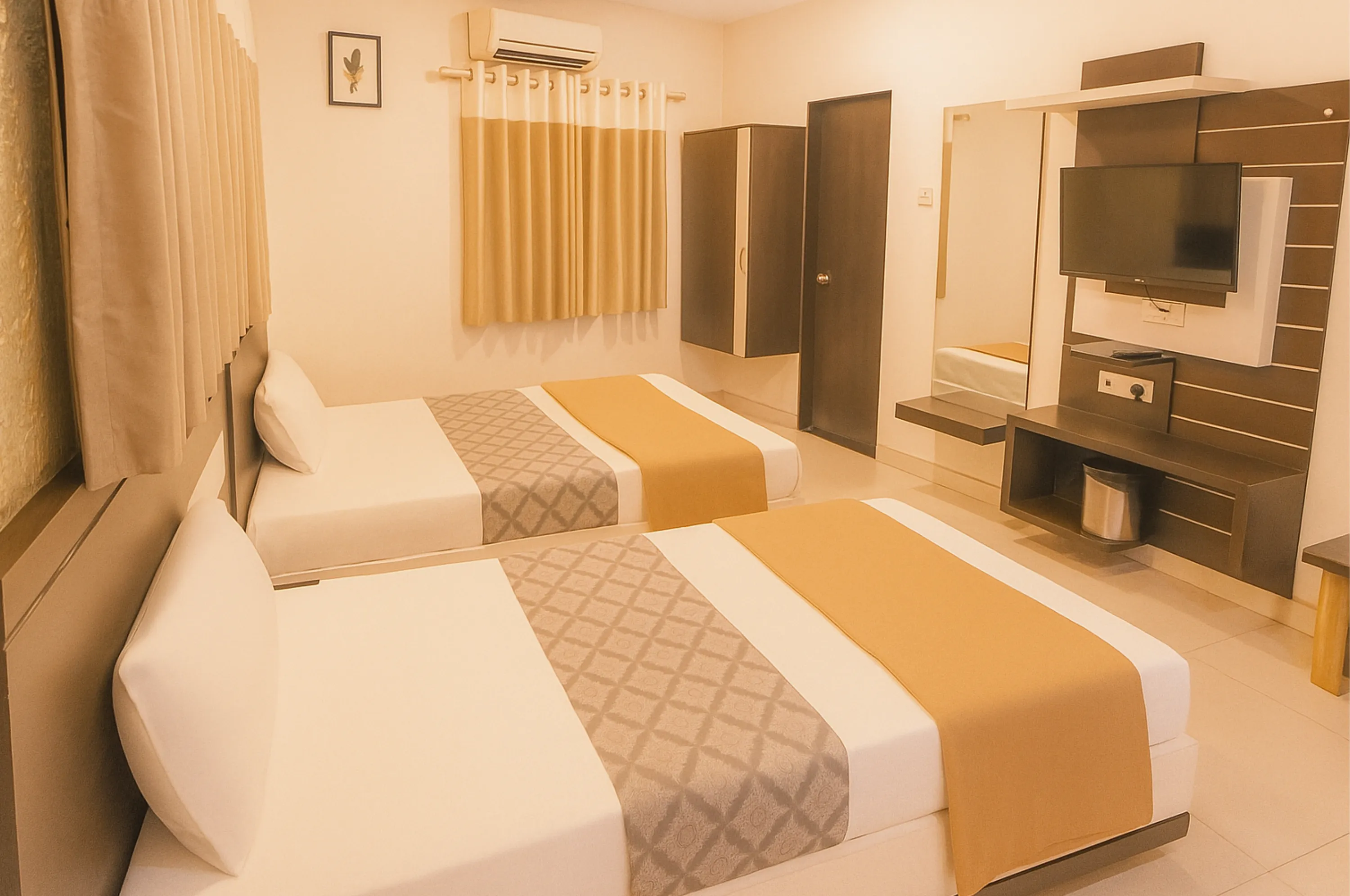 Comfortable triple bed non-AC room at Hotel Vrajbhoomi Somnath