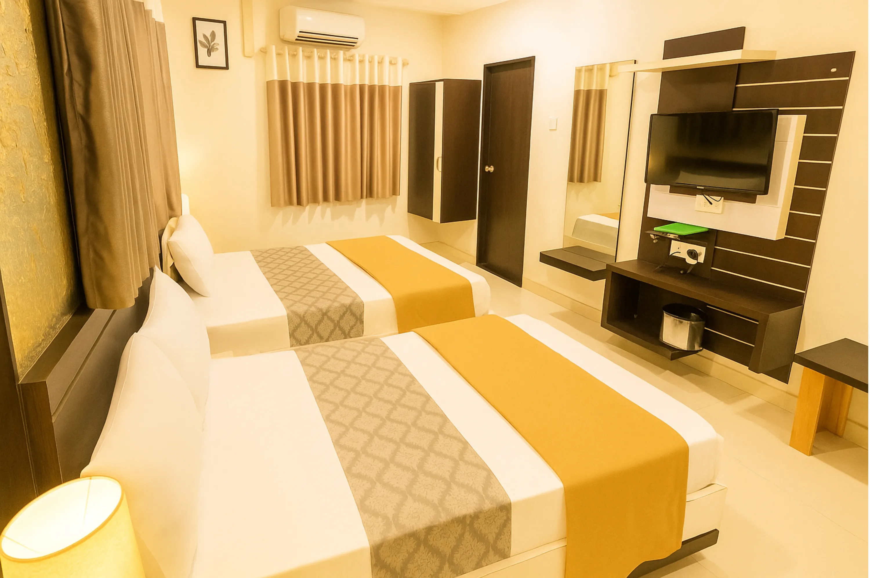 Family triple bed room at Hotel Vrajbhoomi Somnath for group stays