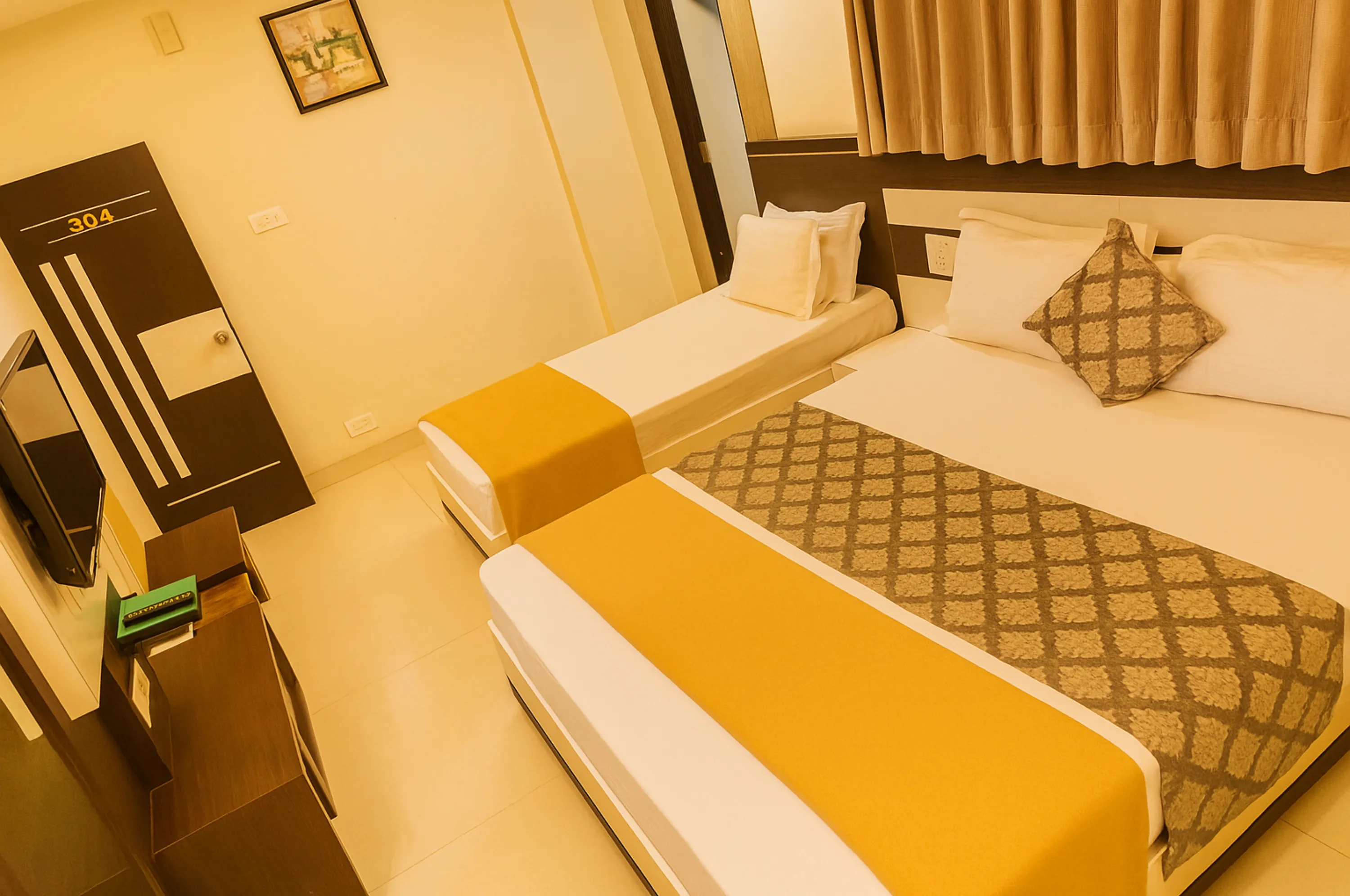 Triple bed AC room in Hotel Vrajbhoomi Somnath with clean interiors